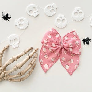PINK SKELLIES • bow